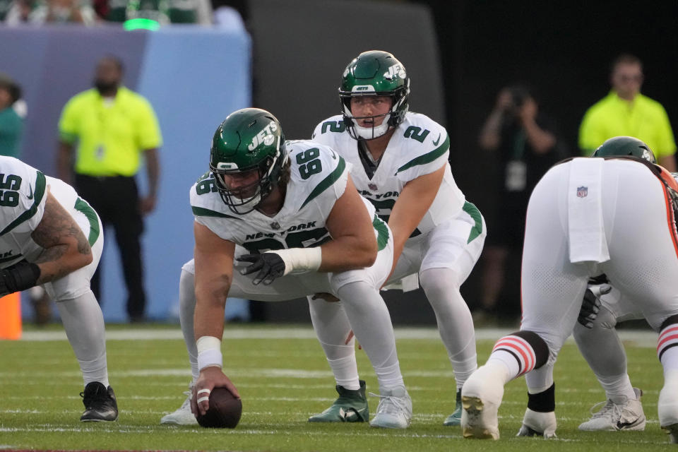 Aug 3, 2023; Canton, Ohio, USA; New York Jets quarterback Zach Wilson (2) takes the snap from center Joe Tippmann (66) against the Cleveland Browns during the first half at Tom Benson Hall of Fame Stadium. Mandatory Credit: Kirby Lee-USA TODAY Sports