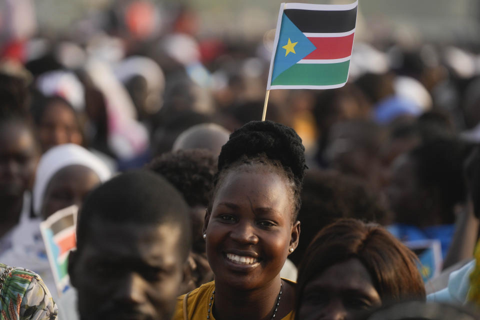 People wait for Pope Francis arrival at John Garang Mausoleum on the occasion of a mass in Juba, South Sudan, Sunday, Feb. 5, 2023. Francis is in South Sudan on the second leg of a six-day trip that started in Congo, hoping to bring comfort and encouragement to two countries that have been riven by poverty, conflicts and what he calls a "colonialist mentality" that has exploited Africa for centuries. (AP Photo/Gregorio Borgia)