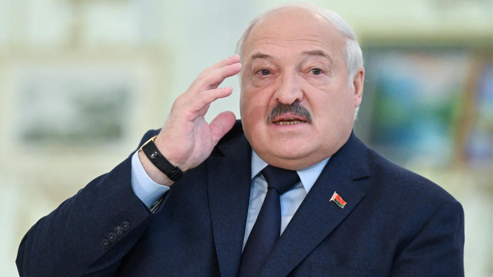 President Alexander Lukashenko, wearing a small pin of the Belarus flag on his lapel.