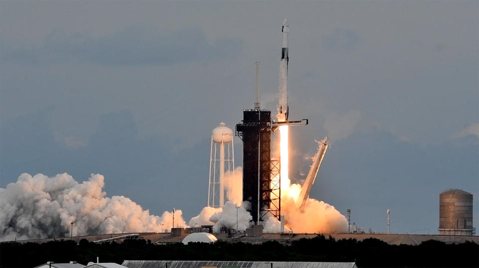 A SpaceX Falcon 9 rocket thunders away from the Kennedy Space Center carrying four private astronauts to the International Space Station for an eight-day research mission. It is the second 