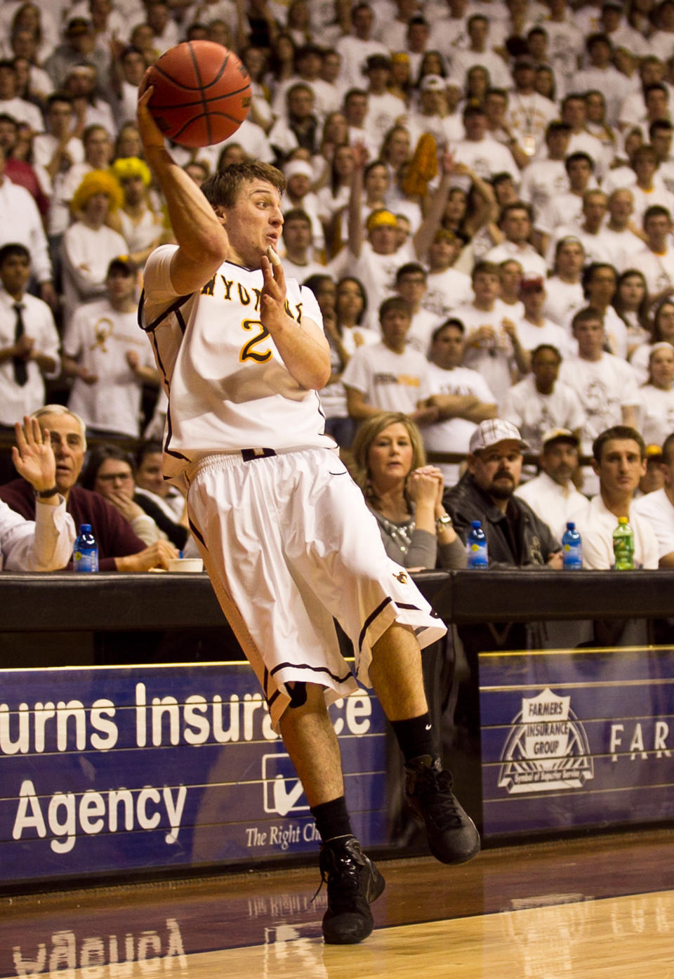 Cowboys junior guard Riley Grabau (2) saves the ball from going out of bounds Tuesday, Feb. 11, 2014 against Sand Diego State at the Arena-Auditorium in Laramie, Wyo. (AP Photo/Jeremy Martin)