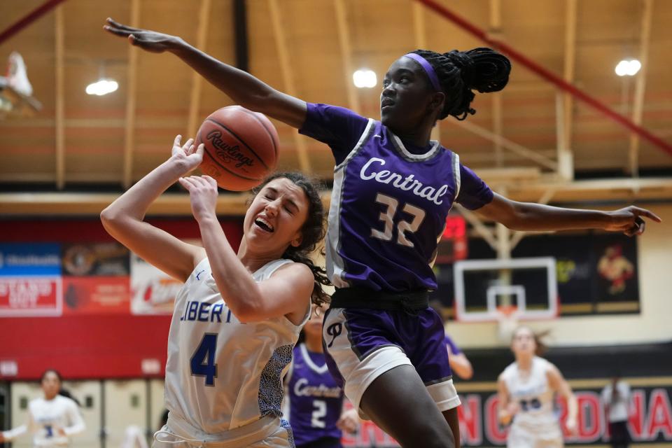 Pickerington Central's Faith King blocks the shot of Olentangy Liberty's Claire Mikola during a Division I regional semifinal March 5. King entered the starting lineup in late January and has been critical to the Tigers' defensive effort during their run to the state tournament.