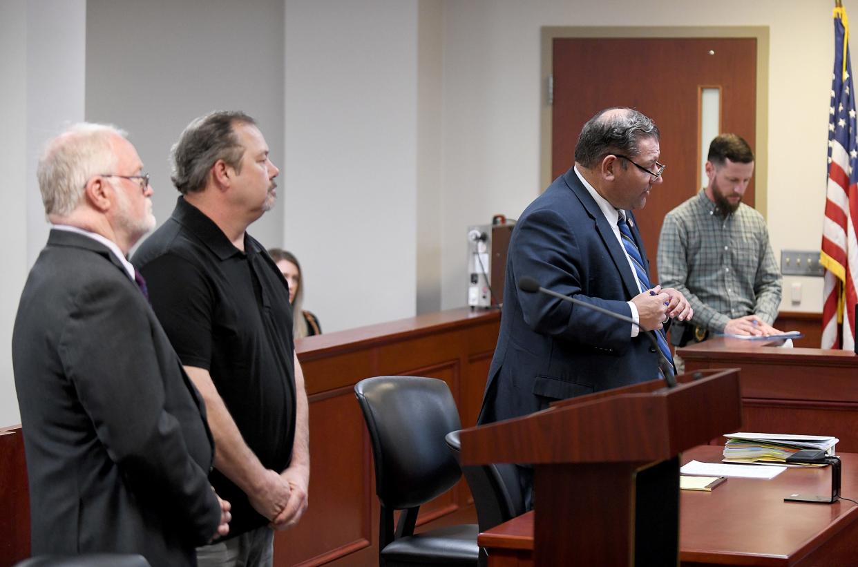 Carroll County Prosecutor Steven D. Barnett speaks behind the podium in Carroll County Municipal Court on Wednesday at the sentencing of Douglas R. Mackey, who is shown standing next to his attorney Jeffrey Jackmides, at left. Judge Gary L. Willen gave Mackey a suspended jail sentence and imposed $630 in fines. The head-on crash occurred when he was driving his employer's truck near Dellroy.