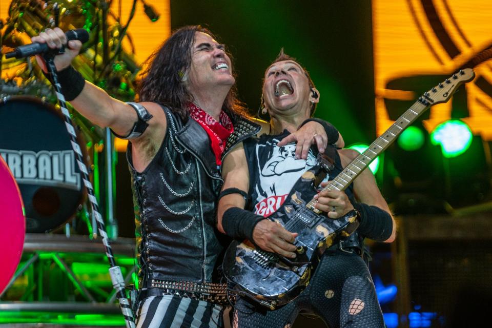 Dave Moody, left, with bandmate Happy during a Hairball performance.