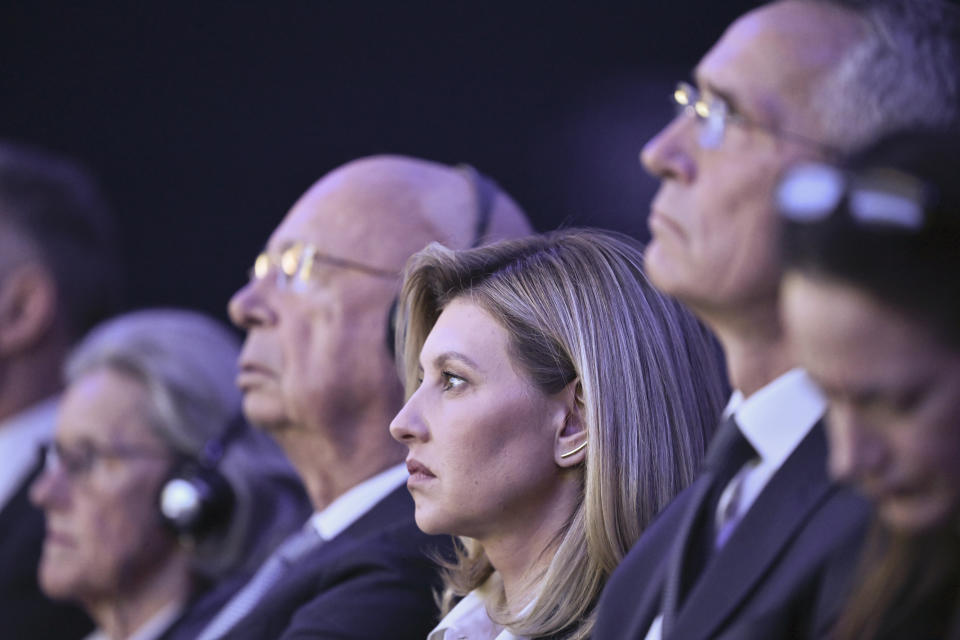 Nato General Secretary Jens Stoltenberg, Ukrainian First Lady Olena Zelenska, Klaus Schwab, President of WEF and his wife Hilde Schwab, from right, listen to Ukrainian President Volodymyr Zelenskyy who delivers a speech by video conference, during the 53rd annual meeting of the World Economic Forum, WEF, in Davos, Switzerland, Wednesday, Jan. 18, 2023. The meeting brings together entrepreneurs, scientists, corporate and political leaders in Davos under the topic "Cooperation in a Fragmented World" from 16 to 20 January. (Gian Ehrenzeller/Keystone via AP)