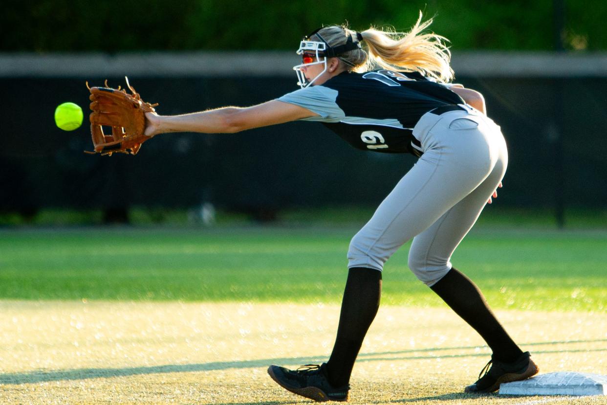 Saint Joseph junior Berkley Zache (19) gets an out at first base during a high school softball game between Saint Joseph and Penn on Monday, May 6, 2024, at Penn High School in Mishawaka. Penn won 8-2.