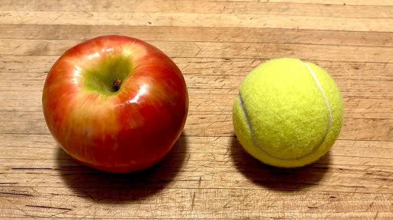 Apple and tennis ball
