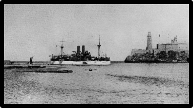 The U.S.S. Maine enters Havana Harbor, Cuba, passing Morro Castle on January 25, 1898.