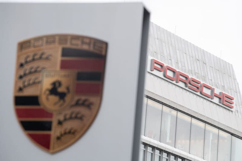 The word "Porsche" is written behind the company logo. Sebastian Gollnow/dpa