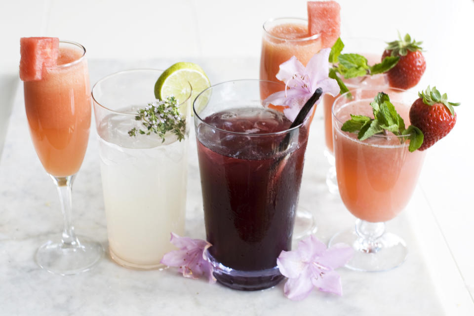 In this image taken on June 3, 2013, from left, a watermelon Bellini, white chiller, dark island cooler, rose tinted glasses wine coolers with a watermelon Bellini behind them are shown in Concord, N.H. (AP Photo/Matthew Mead)