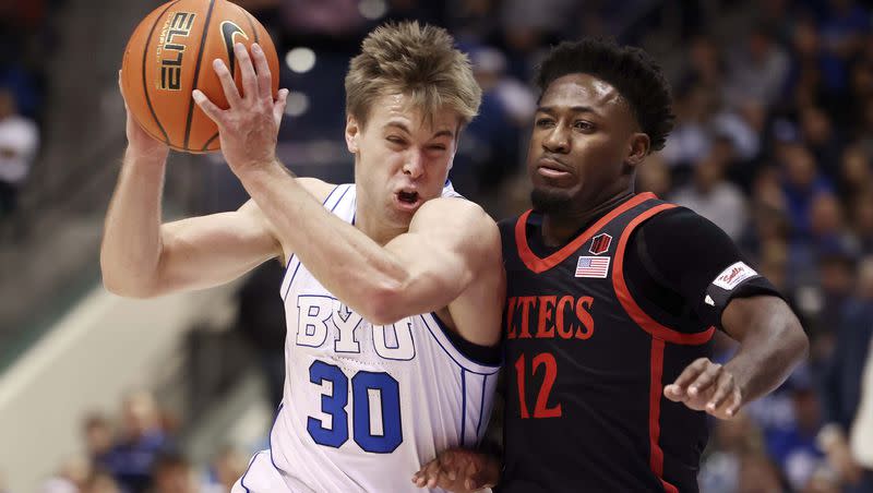 BYU Cougars guard Dallin Hall (30) drives into San Diego State Aztecs guard Darrion Trammell (12) in a game at BYU’s Marriott Center in Provo on Friday, Nov. 10, 2023.