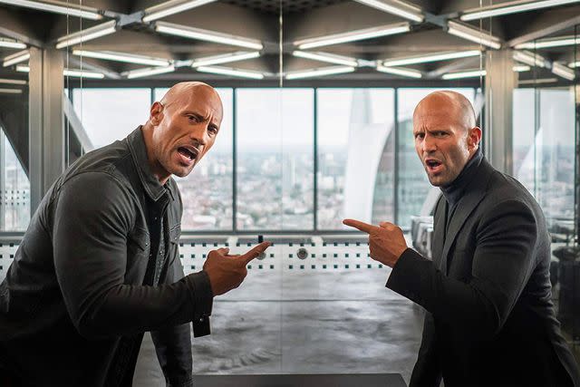 <p>Pictorial Press Ltd / Alamy</p> Dwayne Johnson and Jason Statham in 'Hobbs & Shaw'