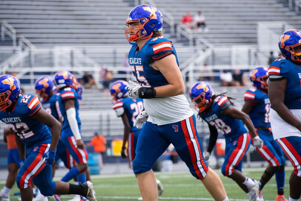 York High sophomore offensive lineman Michael McMonigle (center) warms up with the rest of the Bearcats before taking on Woodland Hills in the Chambersburg Peach Bowl football showcase on Saturday, August 27, 2022.