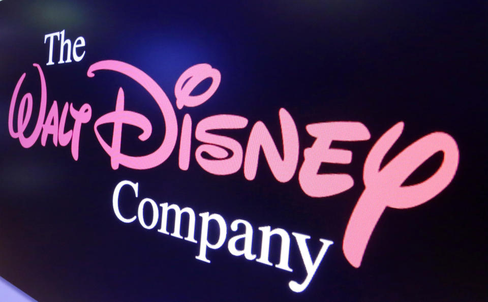FILE - The Walt Disney Co. logo appears on a screen above the floor of the New York Stock Exchange, Aug. 7, 2017, in New York. Hours before the fall's first “Monday Night Football” game, Disney and Charter Communications have settled a business dispute that had left some 15 million cable TV customers without ESPN and other Disney channels. Disney said that because of the deal, the majority of its ESPN customers would have service restored to Charter's Spectrum cable system right away. Charter confirmed the deal Monday, Sept. 11, 2023. (AP Photo/Richard Drew, File)