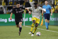 Inter Miami's Lewis Morgan, left, and Columbus Crew's Derrick Etienne chase the ball during the second half of an MLS soccer match Saturday, Oct. 16, 2021, in Columbus, Ohio. (AP Photo/Jay LaPrete)