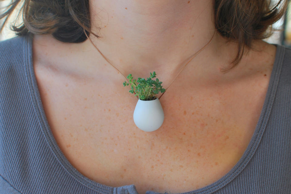 This undated publicity photo provided by Wearable Planter shows a tiny wearable planter created by Colleen Jordan, of Atlanta. Jordan has a degree in industrial design that helps her design tiny wearable planters using 3D modeling software. She exports a finished design to a 3D printing service, such as Shapeways or Ponoko, and receives her finished pieces about two weeks later. (AP Photo/Wearable Planter, Colleen Jordan)