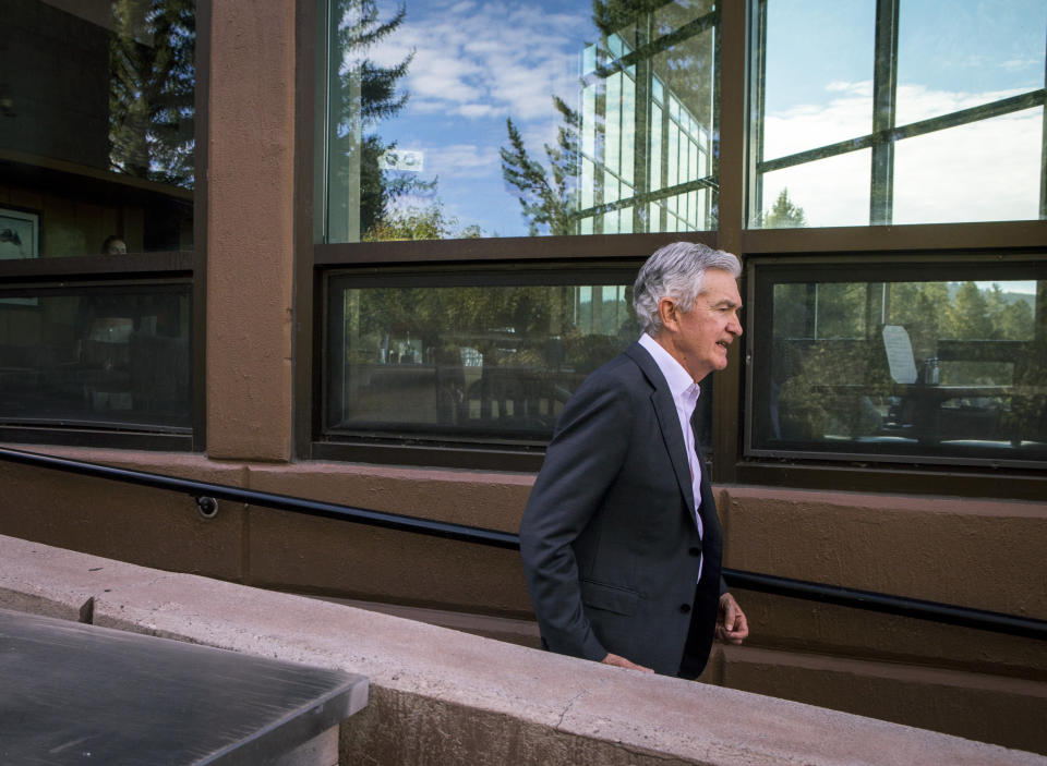 Federal Reserve Chairman Jerome Powell takes a break outside of Jackson Lake Lodge during the Jackson Hole Economic Symposium near Moran in Grand Teton National Park, Wyo., Friday, Aug. 25, 2023. (AP Photo/Amber Baesler)