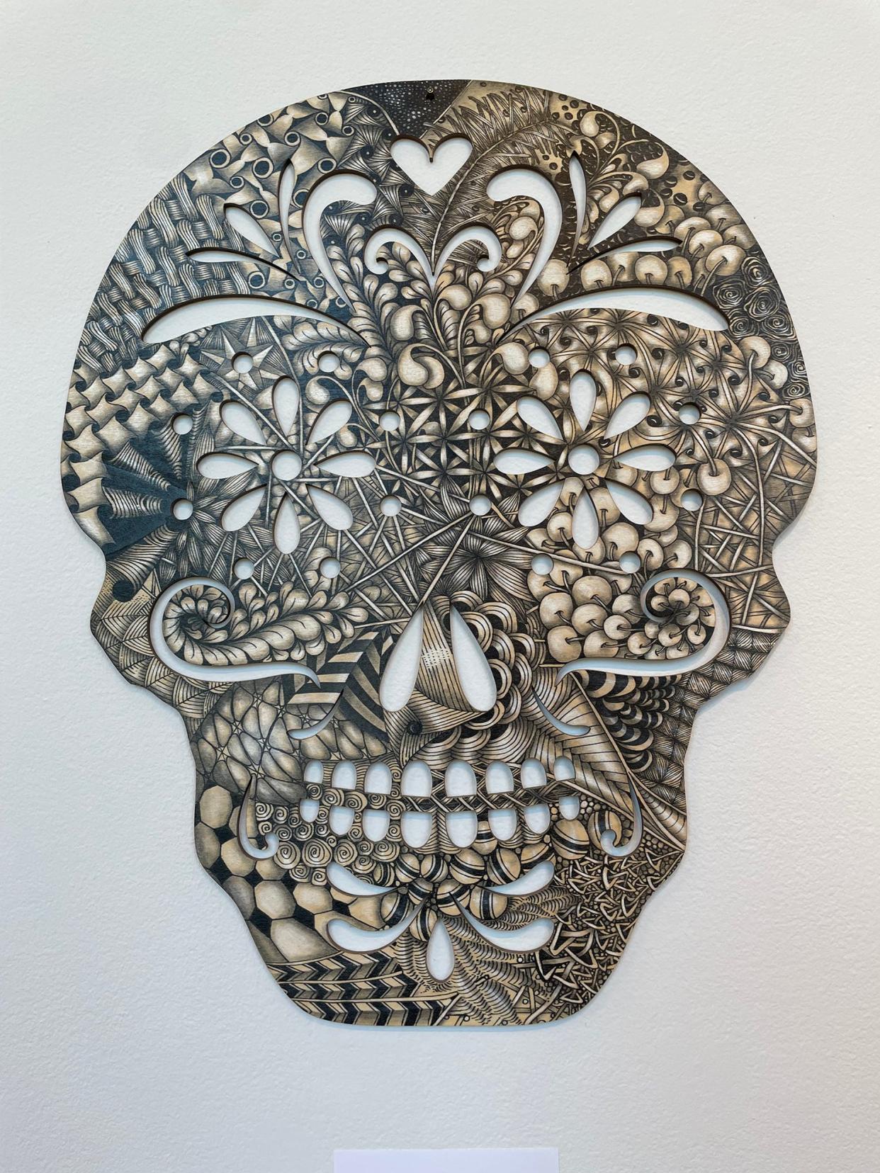 Molly Hollibaugh, daughter of Zentangle co-founder Maria Thomas, created this piece, "Skull," with pigment ink and pencil on wood. The exhibit "Beyond Zentangle" runs through Sept. 1 at the Spaulding R. Aldrich Heritage Gallery in Alternatives' Whitin Mill.