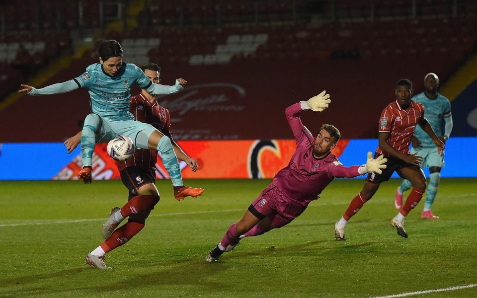 Liverpool's Takumi MinaMino scores the Fifth goal During the Carabao Cup Third Round Match at Sincil Bank Stadium on September 24, 2020 in Lincoln, England.  - GETTY IMAGES