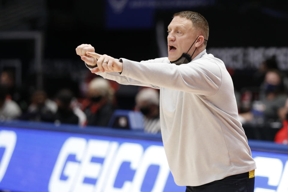 VCU head coach Mike Rhoades shouts to his team against St. Bonaventure during the first half of an NCAA college basketball game for the Atlantic Ten Conference championship Sunday, March 14, 2021, in Dayton, Ohio. (AP Photo/Jay LaPrete)