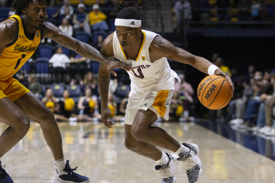 FILE - Arizona State guard DJ Horne (0) looks to drive past California guard Joel Brown (1) during the second half of an NCAA college basketball game, Feb. 11, 2023, in Berkeley, Calif. Horne transferred to the North Carolina State Wolfpack, who will try to return to the NCAA Tournament for the second straight season. (AP Photo/D. Ross Cameron, File)