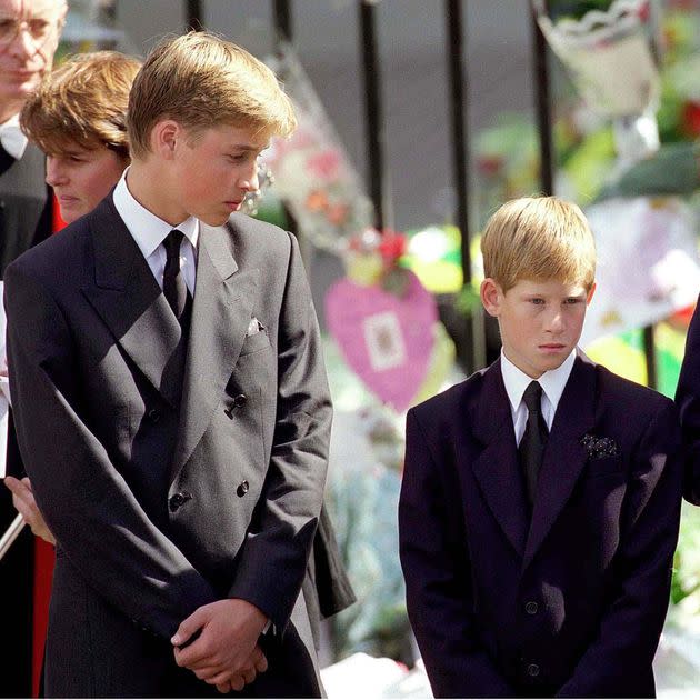 Prince William and Prince Harry stand outside Westminster Abbey at the funeral of Diana, Princess of Wales on September 6, 1997 in London, England. (Photo: Anwar Hussein via Getty Images)