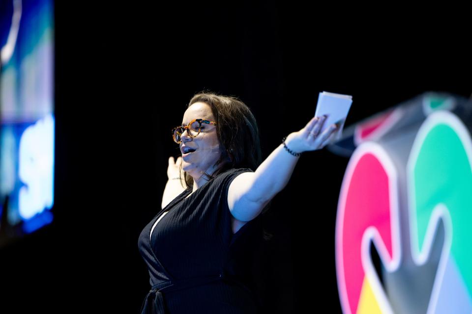 Emcee Lizzy D. Bean welcomes people to the Show Up for Teachers Conference at the Mountain America Expo Center in Sandy on Wednesday, July 19, 2023. | Spenser Heaps, Deseret News