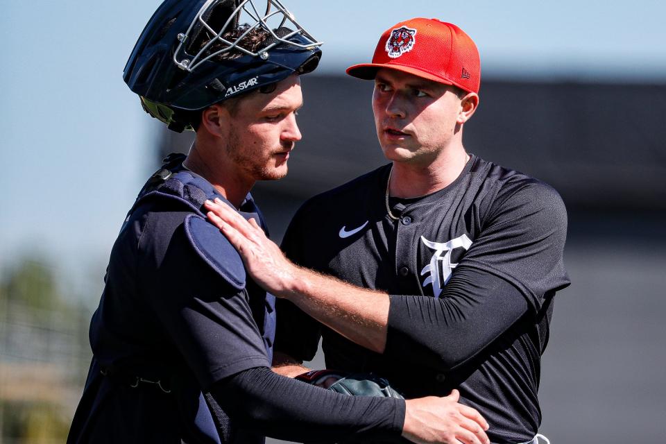 Detroit Tigers pitcher Tarik Skubal talks to catcher Dillon Dingler after live batting practice during spring training at TigerTown in Lakeland, Fla. on Friday, Feb. 23, 2024.