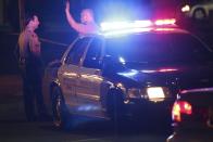 Los Angeles County Sheriff's deputies stand near the scene where a pedestrian was killed in a hit-and-run crash reportedly involving rap mogul Marion "Suge" Knight, in Compton, California January 29, 2015. Knight, 49-year-old co-founder of Death Row Records, was inside the car that struck two people but it was not clear if he was driving, the Los Angeles Times reported. The condition of the second victim was also not immediately known. (REUTERS/Jonathan Alcorn)