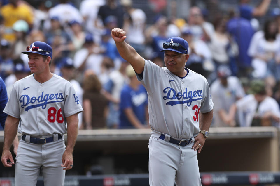 Los Angeles Dodgers manager Dave Roberts gestures to the crowd after the team defeated the San Diego Padres in a baseball game, Sunday, Sept. 11, 2022, in San Diego. (AP Photo/Derrick Tuskan)