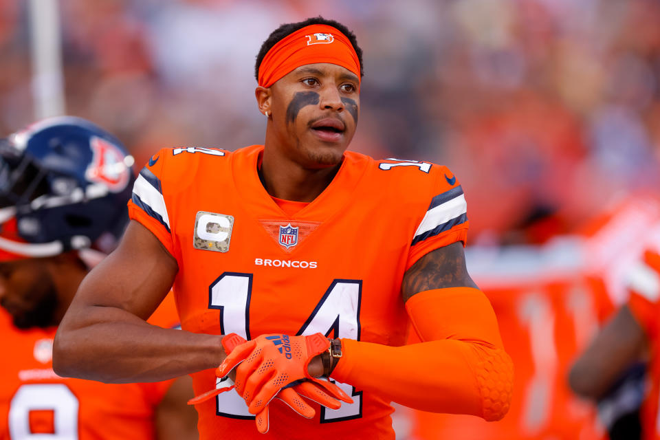 DENVER, CO - NOVEMBER 14:  Wide receiver Courtland Sutton #14 of the Denver Broncos adjusts his gloves on the sidelines during the first half against the Philadelphia Eagles at Empower Field at Mile High on November 14, 2021 in Denver, Colorado. (Photo by Justin Edmonds/Getty Images)