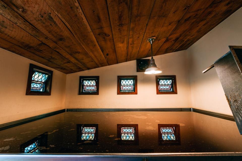 Allagash's coolship, filled with starchy wort, being inoculated by the wild yeasts in the air.