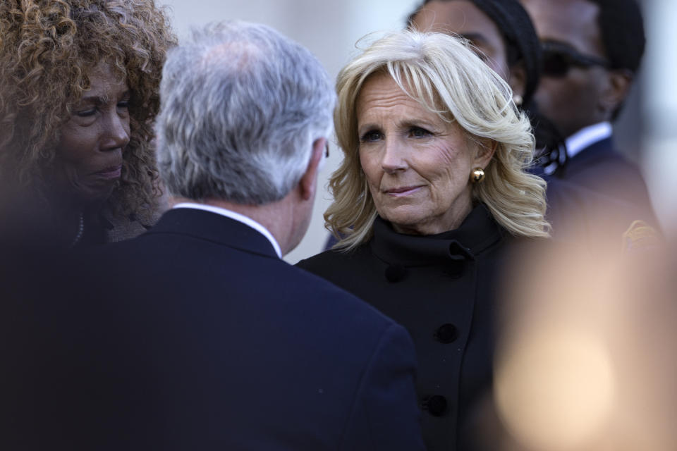 First lady Dr. Jill Biden listens to Nashville mayor John Cooper during a vigil held for victims of The Covenant School shooting on Wednesday, March 29, 2023, in Nashville, Tenn. (AP Photo/Wade Payne)