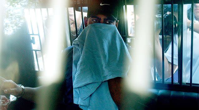 Myuran Sukumaran covers his face shortly after his arrest in 2005. Photo: AAP