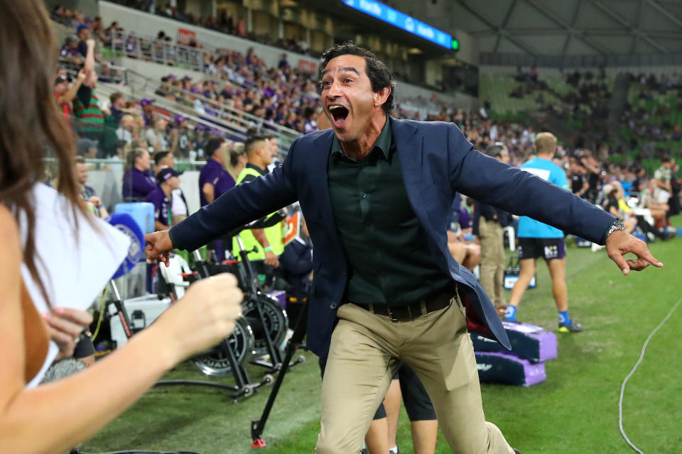 Johnathan Thurston celebrates a try.