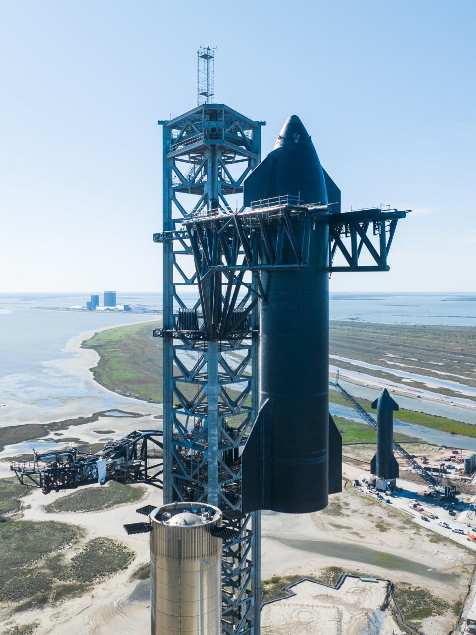 SpaceX destacks its giant Starship Mars rocket at its South Texas facility on Jan. 25, 2023, to continue gearing up for the vehicle's first-ever orbital test flight.