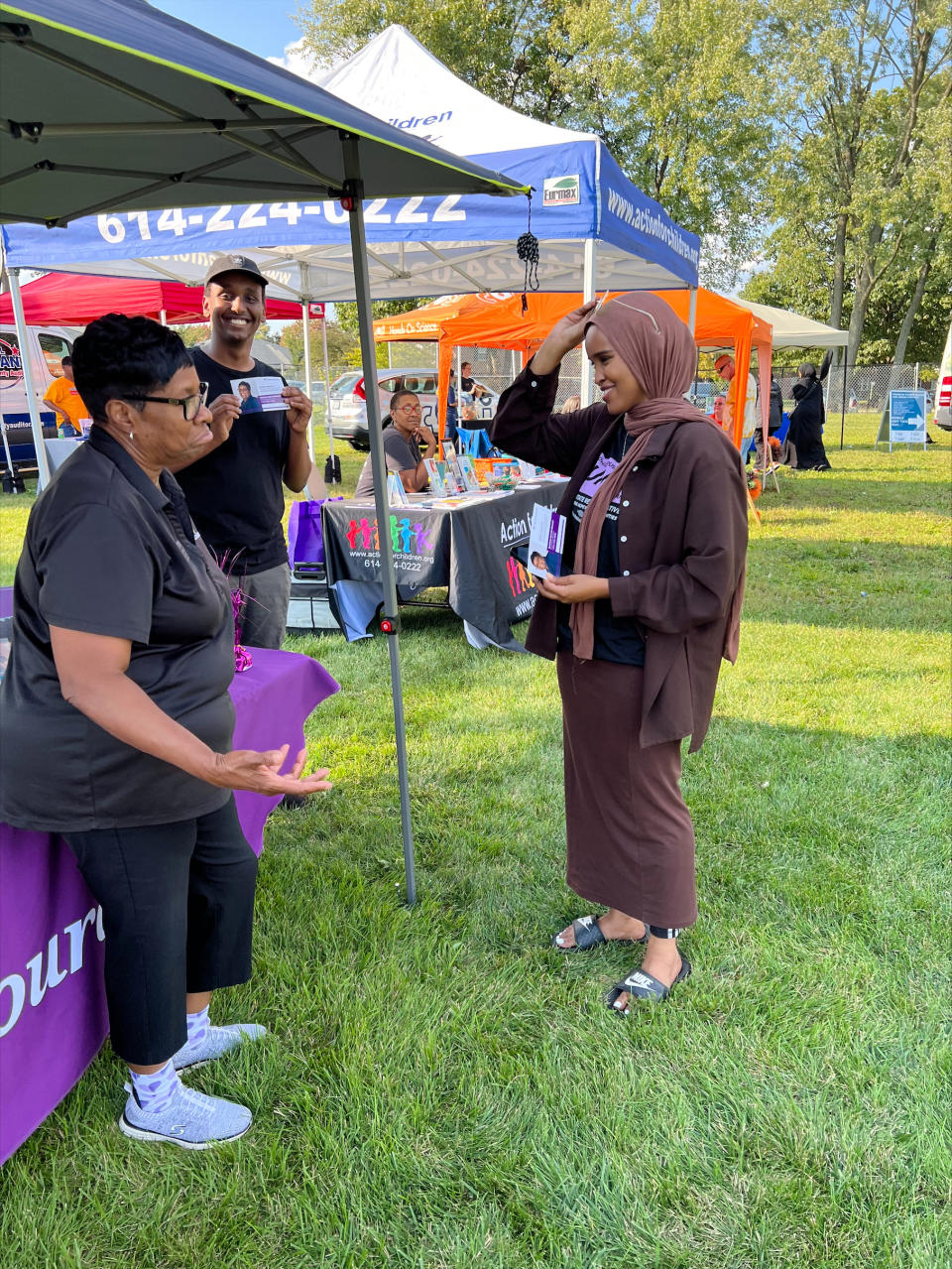 In this undated photo provided by Munira Abdullahi, right, the Democratic candidate running unopposed for the Ohio House of Representatives, chats with potential voters in her home city of Columbus, Ohio. The 26-year-old is all but guaranteed to become the first Somali woman and Muslim woman to serve in the Ohio Legislature. Columbus is home to the second-largest Somali population in the United States. (Munira Abdullahi via AP)
