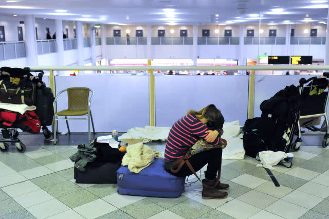 A woman waits for her flight at Gatwick