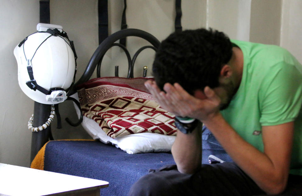 A Syrian Civil Defence reacts in Aleppo after the Nobel Peace Prize announcement