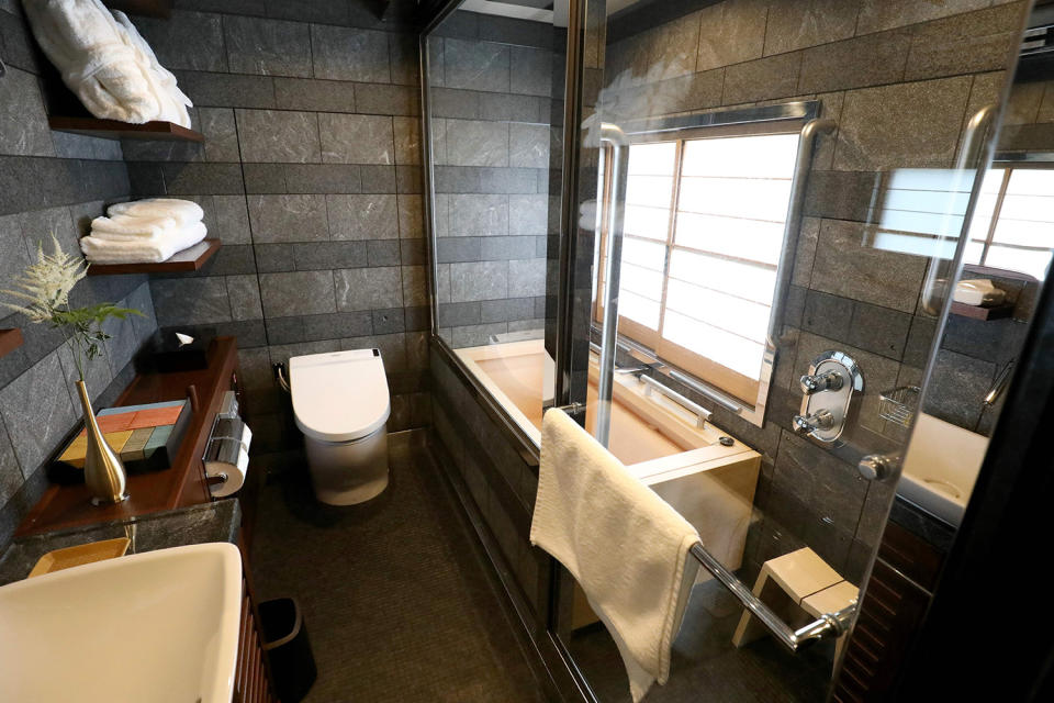 <p>The bathroom set in the Shiki-shima Suite includes a separate shower stall and tub. (Photo: STR/AFP/Getty Images) </p>