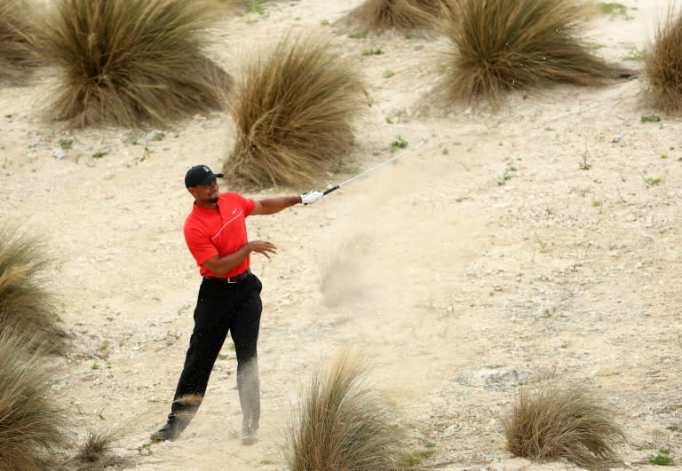 Tiger Woods of the United States hits his second shot on the third hole during the final round of the Hero World Challenge at Albany, The Bahamas on December 4, 2016