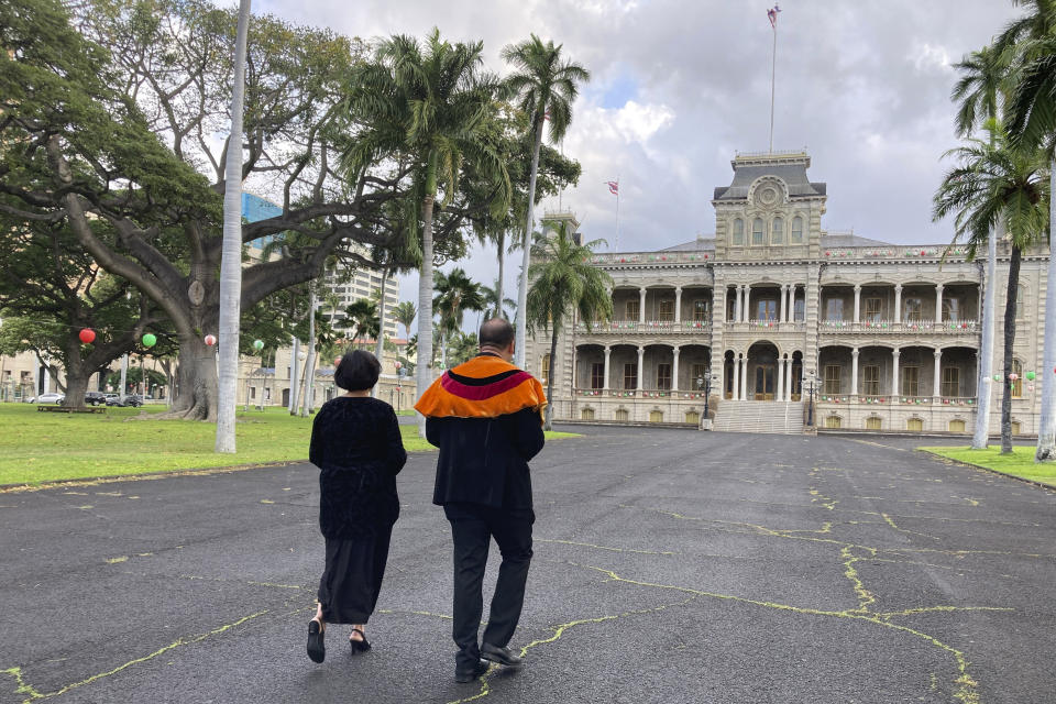 FILE - Paula Akana, left, executive director of ʻIolani Palace, and Hailama Farden, of Hale O Nā Aliʻi O Hawaiʻi, a royal Hawaiian society, leave a news conference Monday, Dec. 12, 2022, at the palace in Honolulu, after announcing the death of Abigail Kinoiki Kekaulike Kawānanakoa at the age of 96. There will be at least $100 million leftover to fund Native Hawaiian causes from the estate of the so-called last Hawaiian princess who died last year. (AP Photo/Jennifer Sinco Kelleher, File)