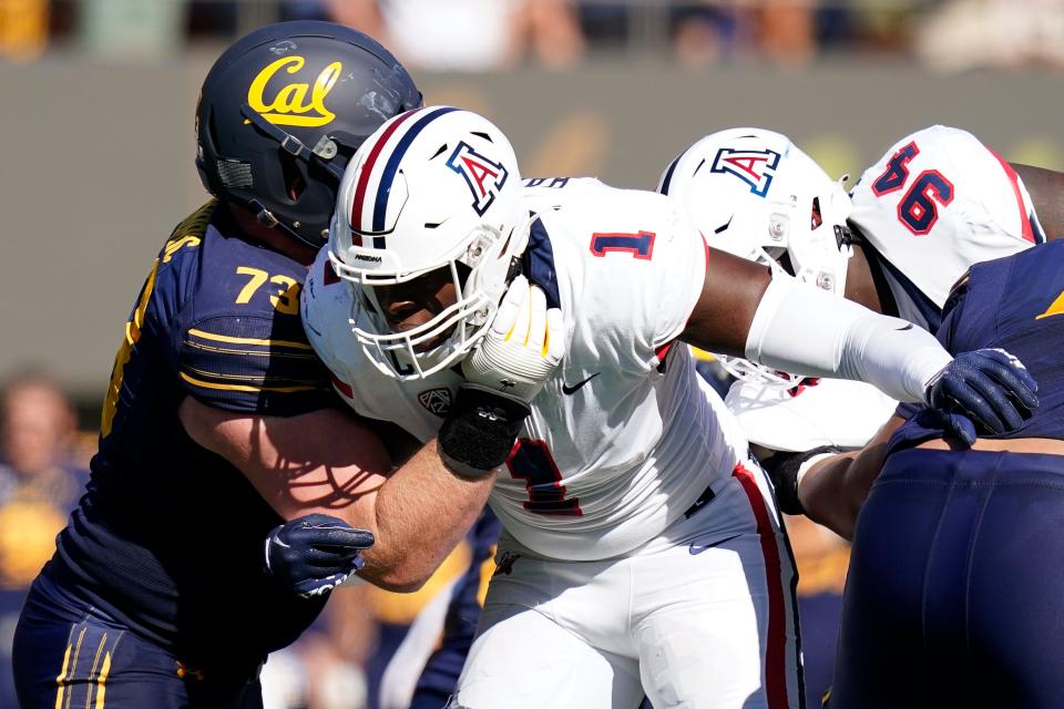 Arizona defensive lineman Jalen Harris (1) tries to get past California offensive lineman Matthew Cindric (73) during the first half of an NCAA college football game in Berkeley, Calif., Saturday, Sept. 24, 2022. (AP Photo/Godofredo A. VÃ¡squez)