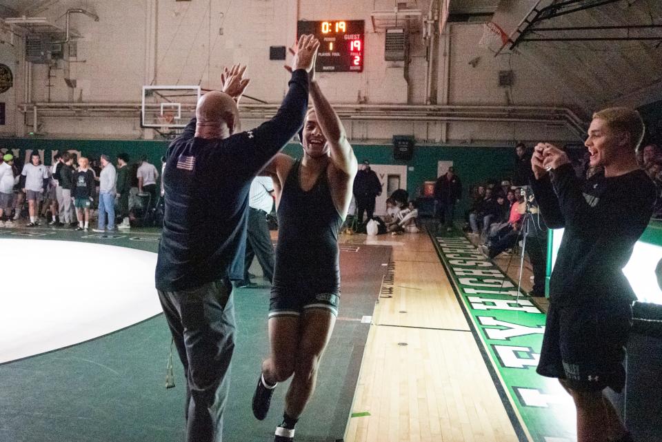 Victor Valley head coach CT Campbell celebrates with Jose Rodriguez at the end the CIF-Southern Section Division 3 Dual Meet Championships on Wednesday, Jan. 31, 2024. Victor Valley captured the title by beating South Torrance 49-19.