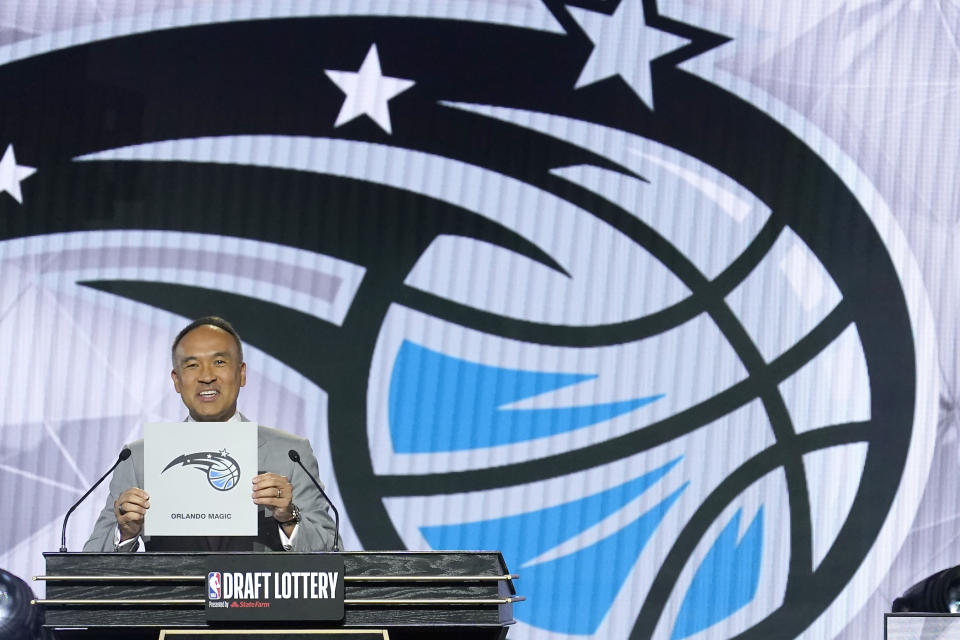 NBA deputy commissioner Mark Tatum announces that the Orlando Magic have won the first pick in the 2022 NBA Draft during the 2022 NBA basketball Draft Lottery Tuesday, May 17, 2022, in Chicago. (AP Photo/Charles Rex Arbogast)