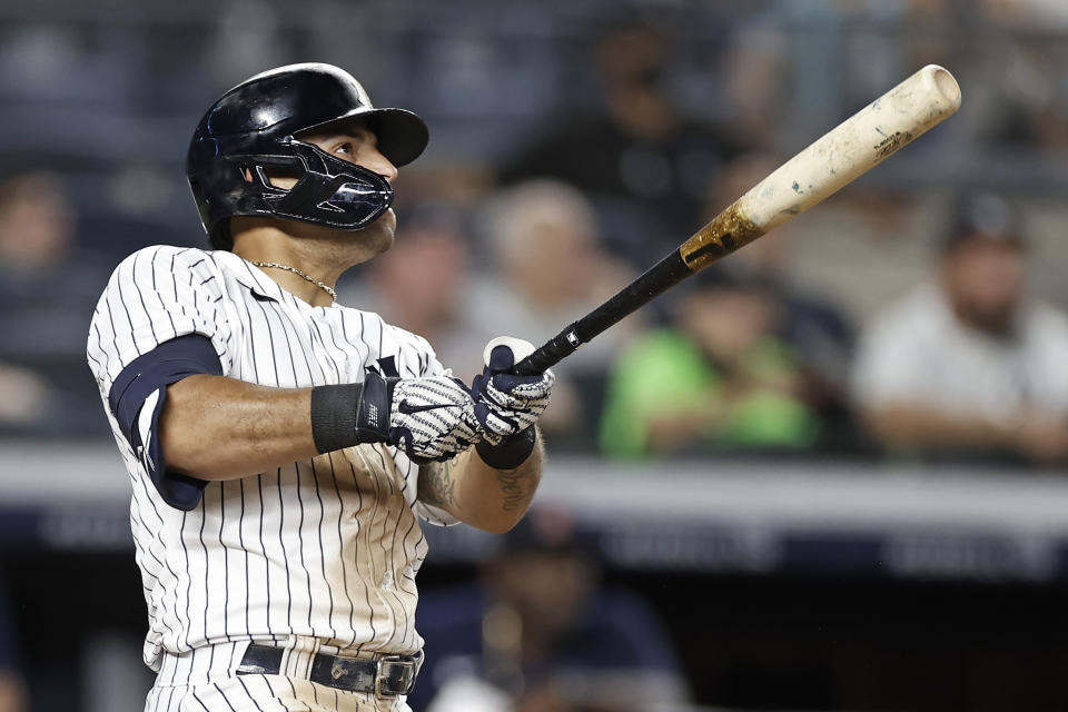 New York Yankees' Rougned Odor watches his 2-run home run during the seventh inning of a baseball game against the Boston Red Sox on Sunday, July 18, 2021, in New York. (AP Photo/Adam Hunger)