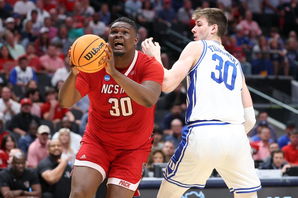 North Carolina State forward DJ Burns Jr. (30) drives against Duke forward Kyle Filipowski during South Regional championship game of the 2024 NCAA men's tournament at American Airline Center.