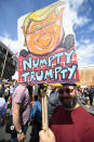 <p>A man holds an anti-Trump sign on July 14, 2018, in Edinburgh, Scotland, while the U.S. president is visiting Trump Turnberry Luxury Collection Resort in western Scotland. (Photo: Jeff J. Mitchell/Getty Images) </p>