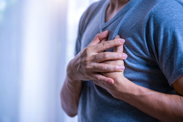 <p>Getty</p> Stock image of a person clutching their chest