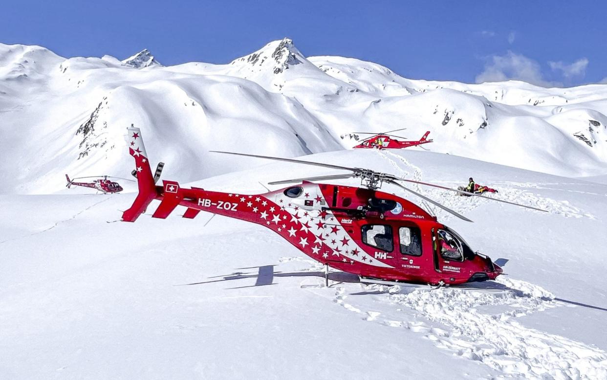 Helicopters in the rescue operation at the Petit Combin mountain in the Swiss Alps